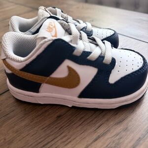 Nike Kids' Sneakers in White, Black, and Gold